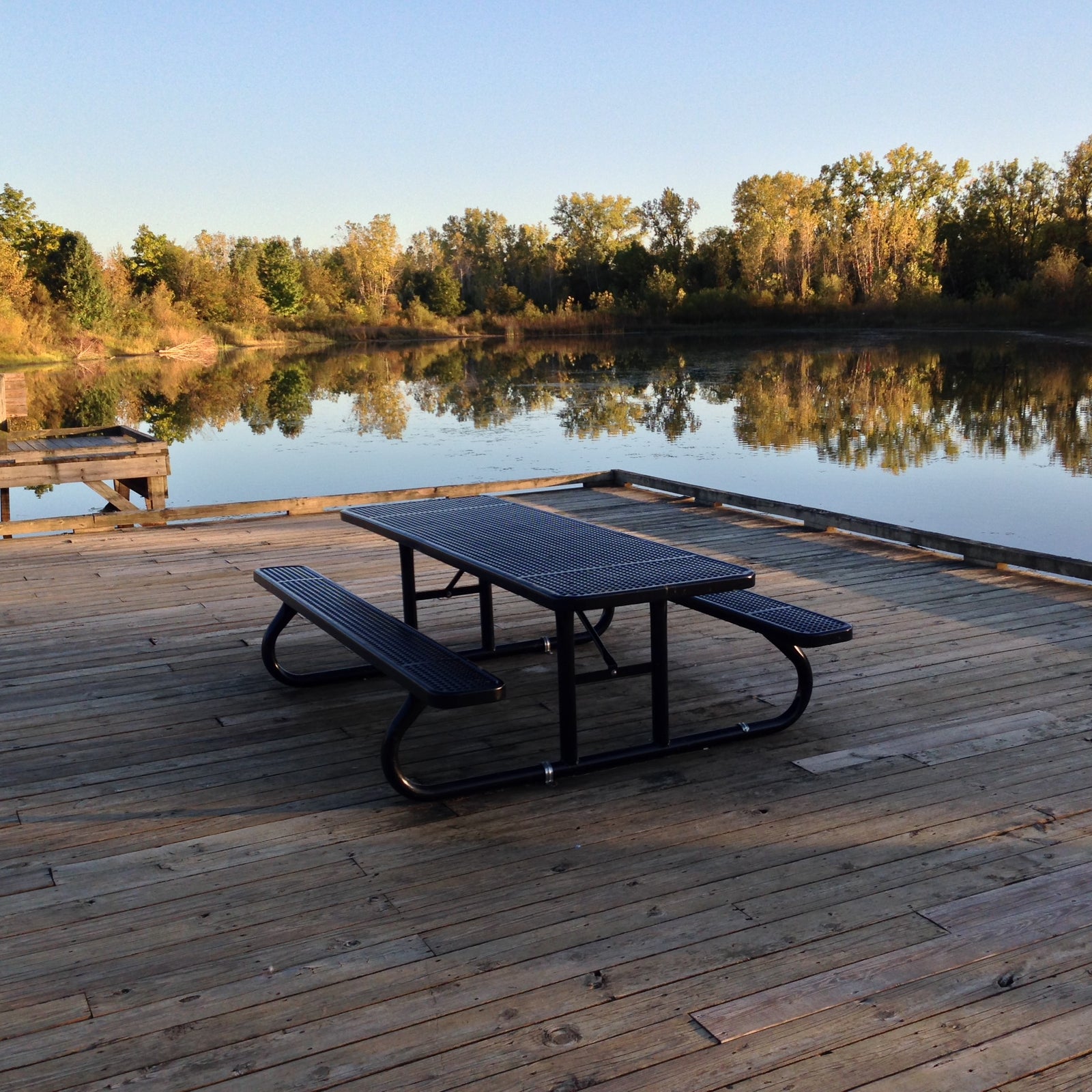 Wabash valley picnic table on a dock surrounded by water