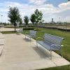 Silver benches outside of a park